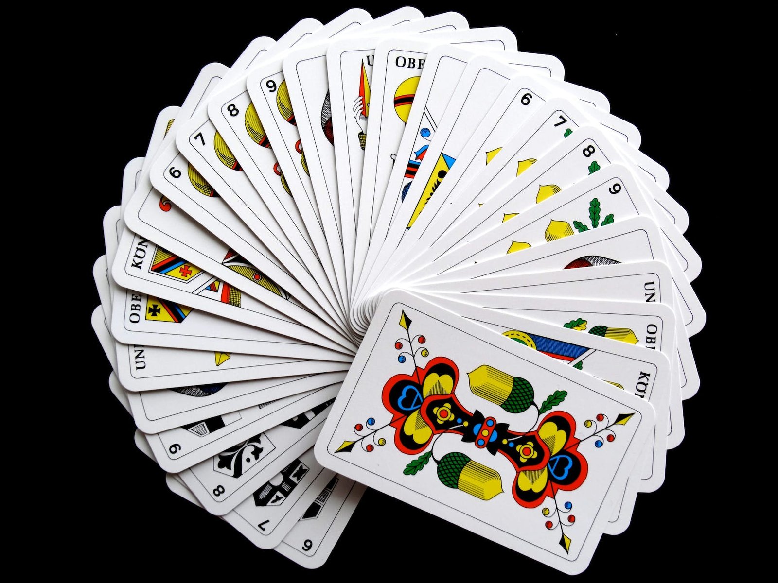 white and yellow playing cards