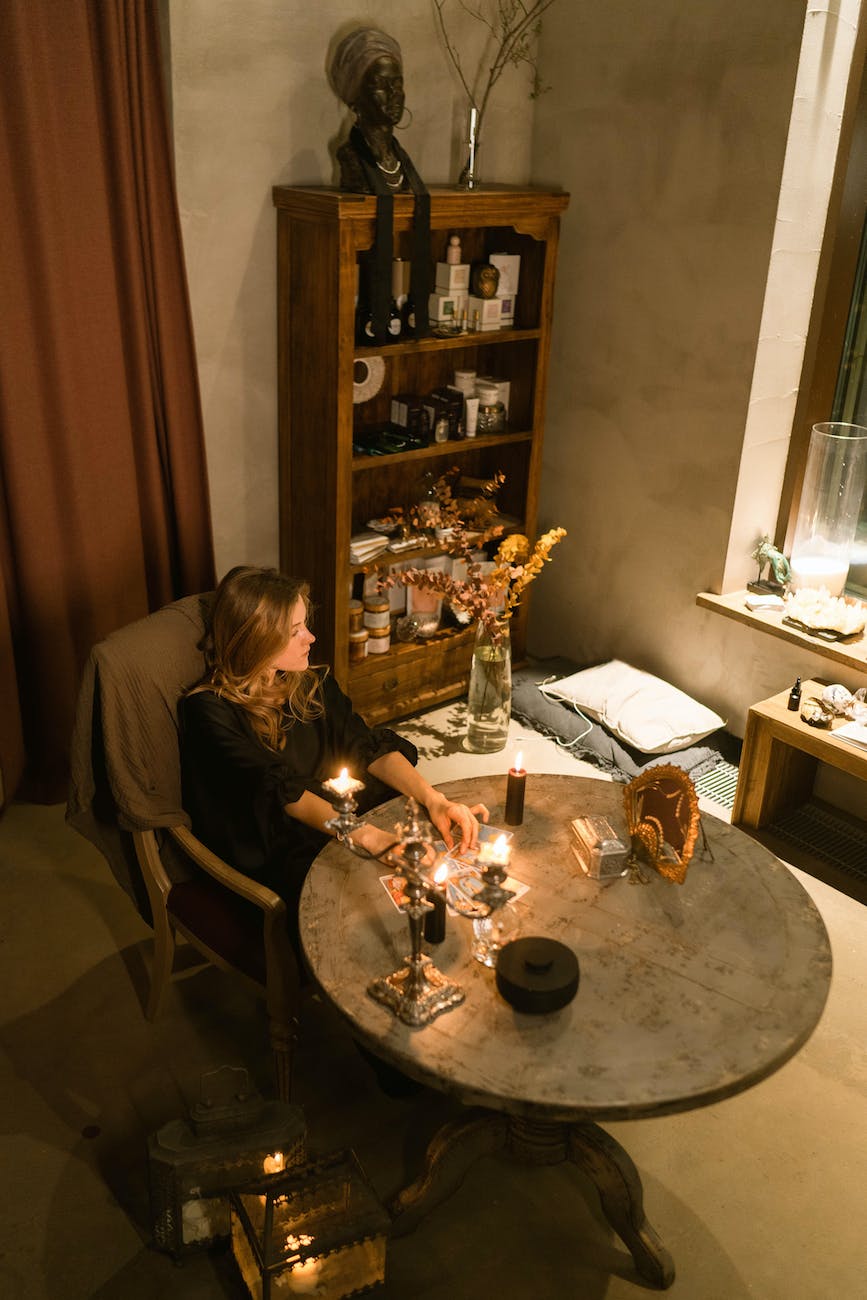 a woman reading the tarot cards on the table