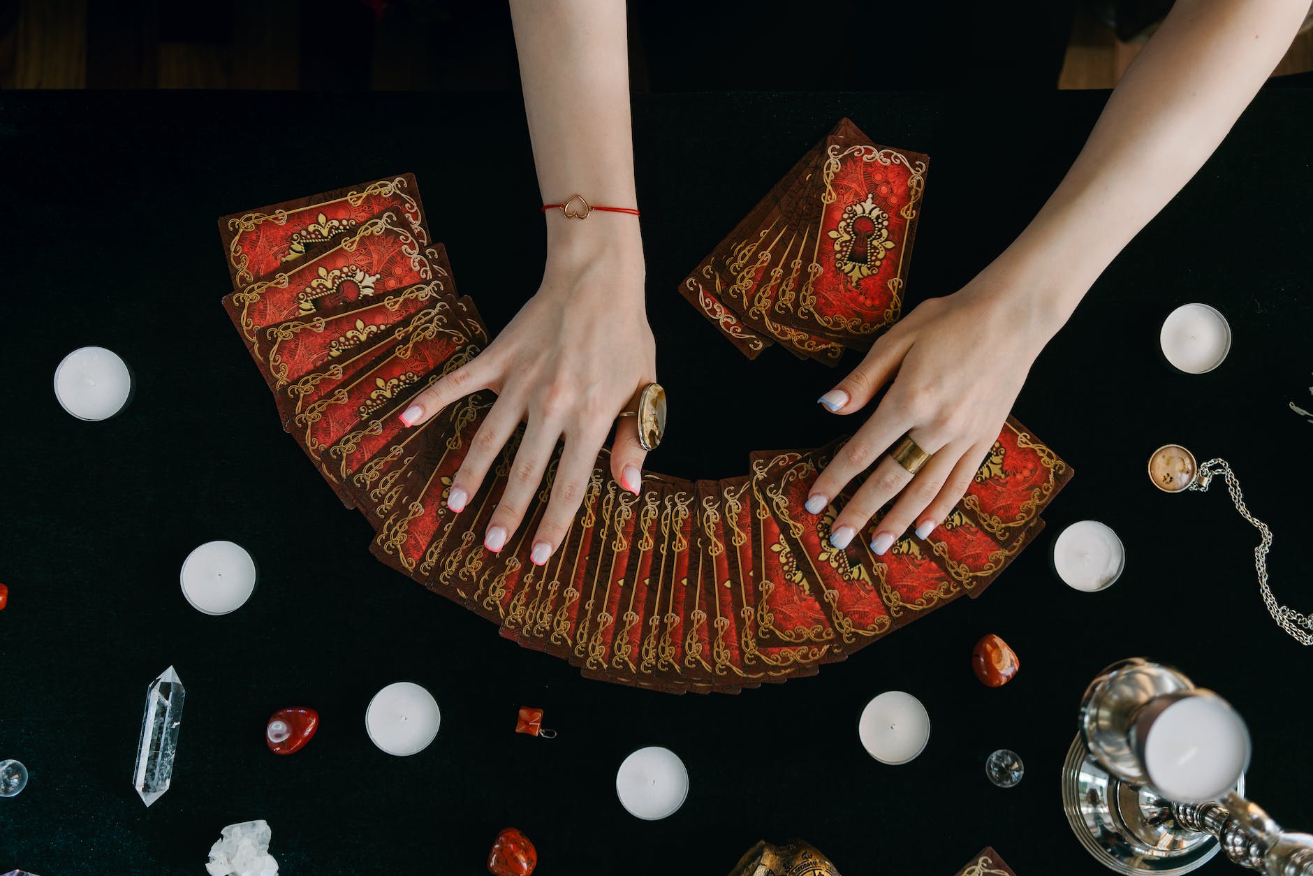 a person holding tarot cards