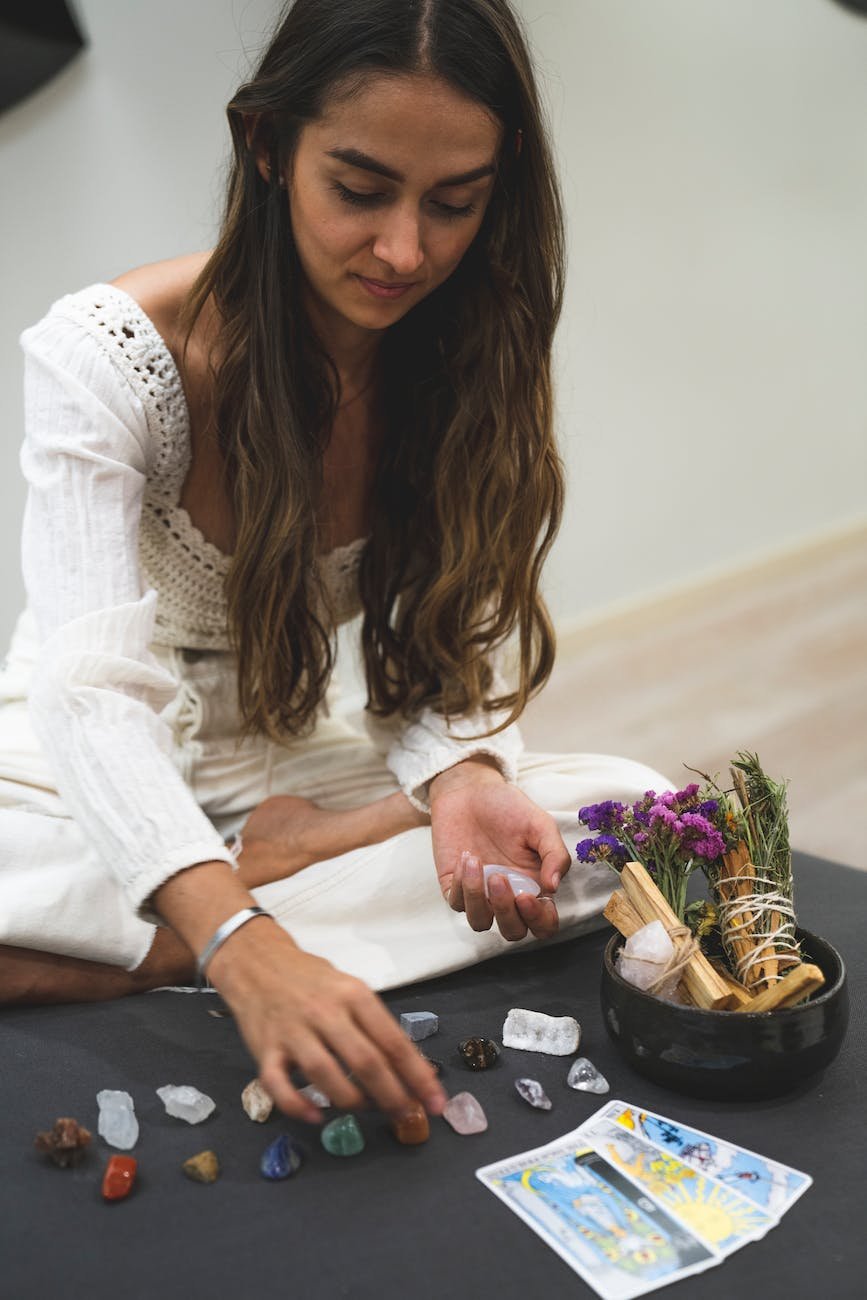 woman arranging stones