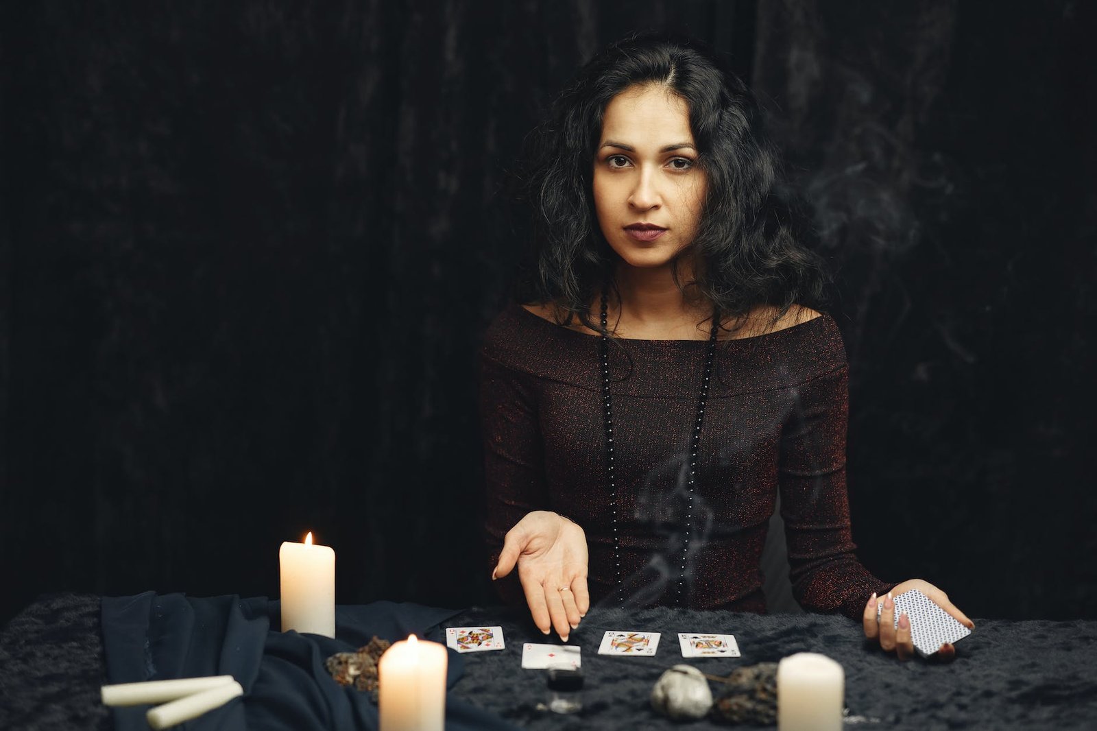 woman reading playing cards